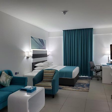 City Avenue Al Reqqa Hotel Дубай Екстериор снимка